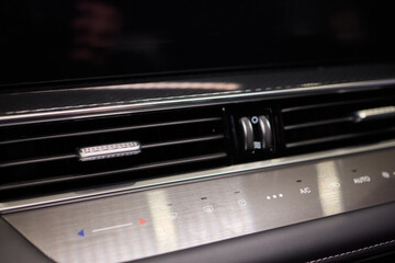 Obraz premium Closeup of car dashboard air vents near gear shift