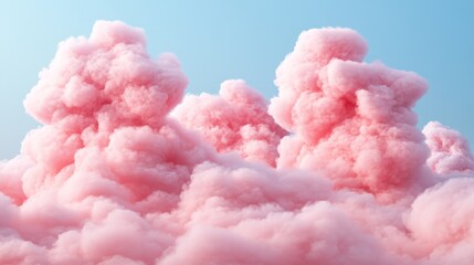 Soft pink clouds glowing under golden sunlight in the sky
