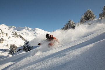 Exciting freeride skiing through pristine snowy landscape