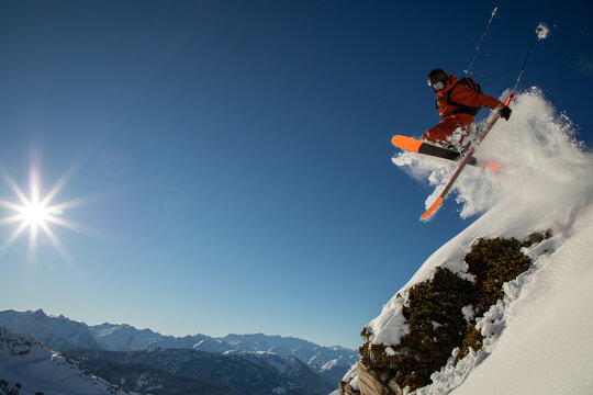 Freeride Skier Takes a Thrilling Jump in Snowy Mountains