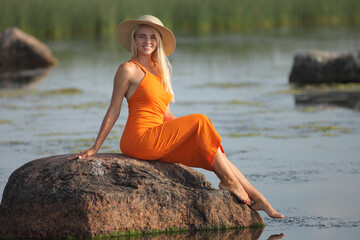 young woman in dress on the beach