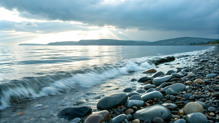 Obraz premium seascape and water and tide concept as Gentle tide moving over pebbles on the shore symbolizing the flow of time; ample copy space for text placement. in Photo Stock Concept and empty space on the 