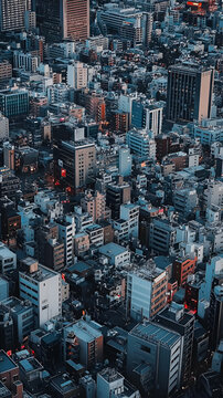 Aerial view of a densely populated urban landscape with various buildings and structures.