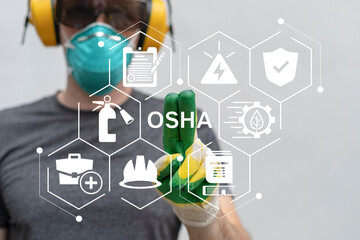 Industry engineer working on virtual touch screen push abbreviation: OSHA. OSHA Occupational Safety...