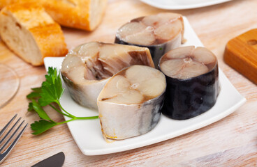 Delicious salted mackerel with parsley on white plate