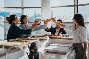 A group of business colleagues share a relaxed lunch break, enjoying pizza and camaraderie in a...