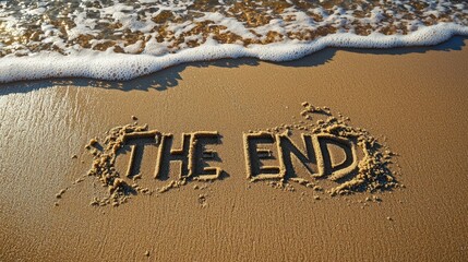 The words "THE END" written in the sand on the beach, Top view, written by hand, written as if it were carved into the soft sand. 