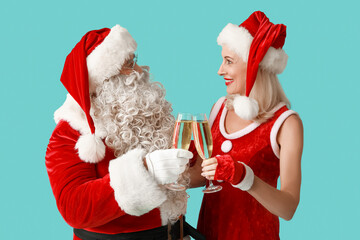Santa and MRS Claus with glasses of champagne on blue background