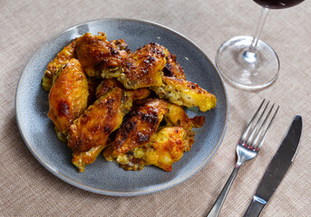 Delicious fried chicken wings served on platter