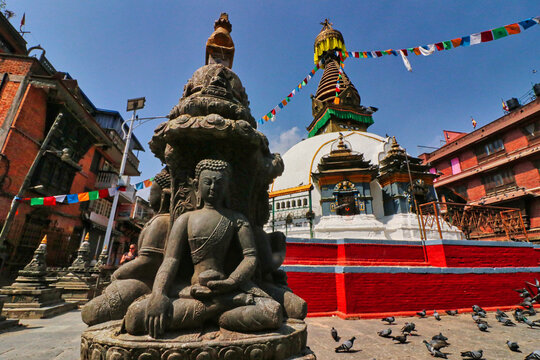 Buddha Trinity idols under a miniature pagoda in front of the Kathi Swayambhu Buddhist Chaitya and stupa in the Thamel area of Old Kathmandu,near durbar square,Nepal 