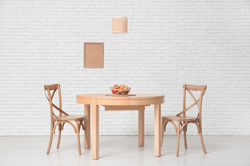 Table with basket of apples in dining room