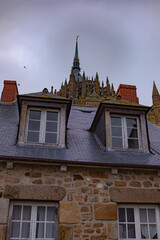 Mont Saint-Michel, Normandy, France, cloudy gloomy evening, sunset sky