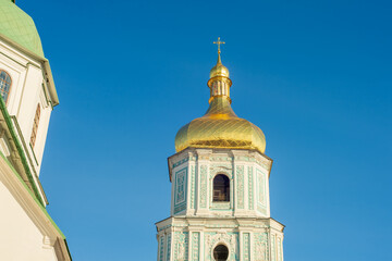gilded domes of st sophia cathedral in Kyiv against blue sky
