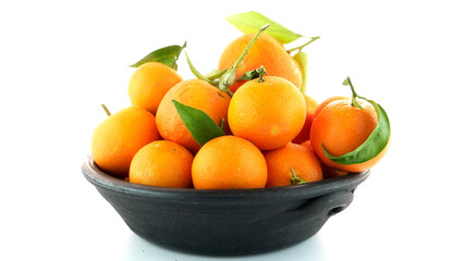 Tangerines on clay bowl
