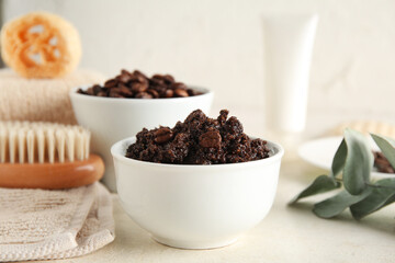 Composition with bowls of coffee body scrub and coffee beans on light grunge background