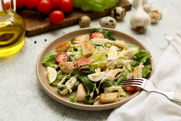 Plate with tasty chicken Caesar salad and ingredients on white background, closeup
