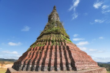 Exploring stupa monuments in Xieng Khouang, Laos against a clear blue sky
