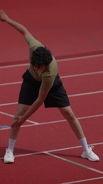 An Athlete Getting Ready for a Sprint Race on the Track with Great Determination and Focus
