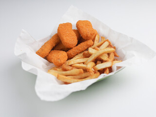 Chicken nugget and fries in white paper 