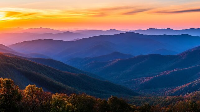 A panoramic view of the mountain ranges in the golden hour light, with the sunset casting rich, warm tones across the rugged terrain 