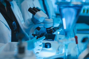 lab, scientist working on scientific equipment in modern laboratory, International team of scientists working together in medical laboratory doing research on chemicals and bacteria