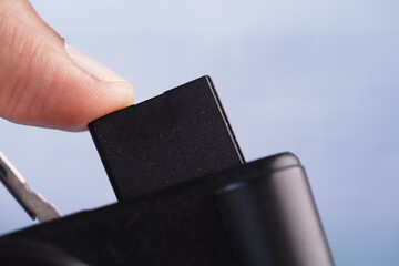  putting SD memory card in a camera 