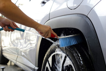 Washing car, cleaning tires and wheels