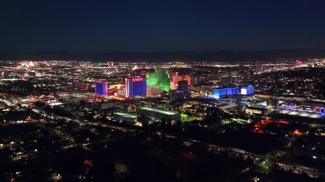Reno Nevada - Downtown Reno Skyline Aerial Approach Over Highway at Night