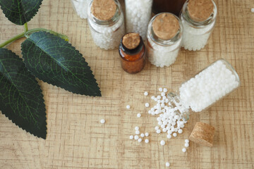 Homeopathic pills containers on a table 