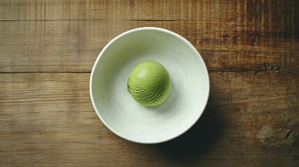 Matcha Ice Cream in a Simple White Bowl on Wooden Table