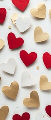 Obraz premium Festive Arrangement of Red, Gold, and White Paper Hearts with Textured Surface