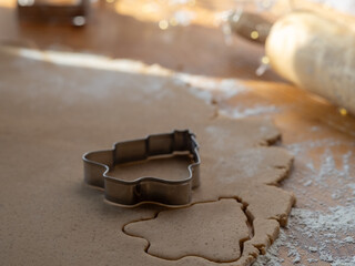 cookie dough and molds to make Christmas cookies. gingerbread man