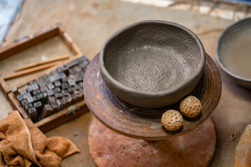 Vintage Crafting Tools for work with clay and Accessories Amidst a Rustic Table 