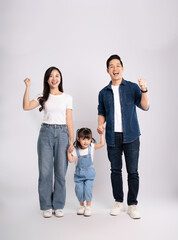 full body  of a happy asian  family posing on a white background