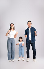 Fototapeta premium full body of a happy asian family posing on a white background