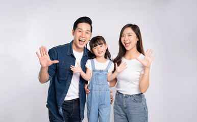 Obraz premium portrait of a happy asian family posing on a white background