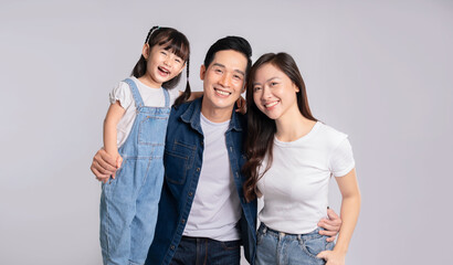 Fototapeta premium portrait of a happy asian family posing on a white background