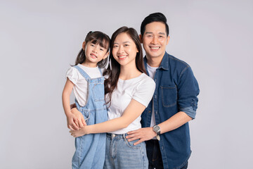 Fototapeta premium portrait of a happy asian family posing on a white background