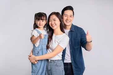 Fototapeta premium portrait of a happy asian family posing on a white background