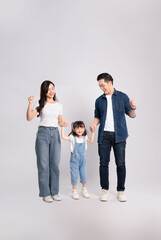 Fototapeta premium Full body image of Asian family posing on white background