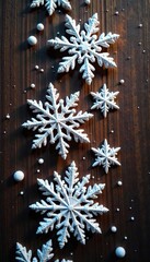 A line of six intricate snowflakes with a luxurious golden sheen on a wooden panel, snowy details, icy formations