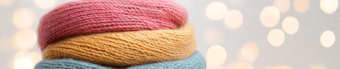 Elegant Winter Style Cozy Knit Scarves with Warm Tones and Holiday Bokeh Background