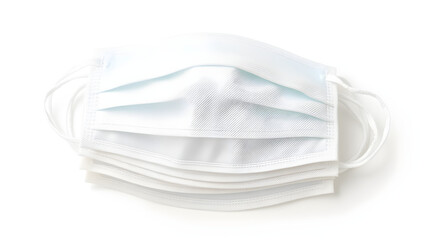 A pack of organic cotton face masks, stacked and isolated on a white background