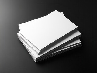 A Stack of Blank Sheets of Paper on a Dark Surface Creating a Minimalist and Clean Aesthetic for Various Creative and Professional Applications