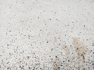 The cement surface has stains.