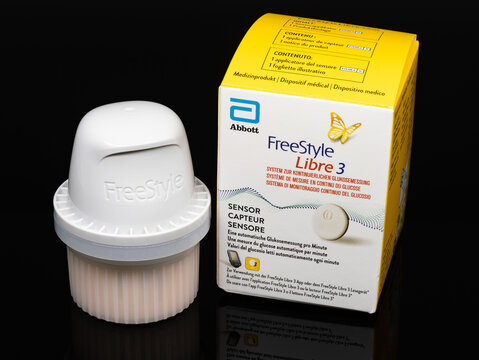 DRESDEN, GERMANY - 19. January 2024: FreeStyle Libre 3 applicator with the CGM sensor inside. The digital health product helps diabetes patients monitoring the glucose continuously in the body.