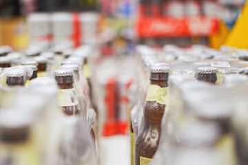 Bottled beverages displayed in a supermarket aisle