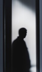 The shadow of a person on an elevator door