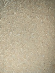 natural sawdust texture background, natural beige background with fine wooden particles, perfect for carpentry