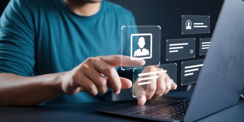 Person using laptop accessing digital profile information